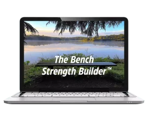 Download The Bench Strength Builder - A scenic lake view on a laptop screen that says "The Bench Strength Builder"